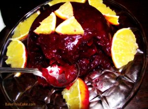Homemade molded cranberry sauce with oranges by BakeThisCake