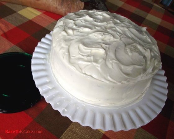 Whipped Cream Cake on milk glass plate by Bake This Cake