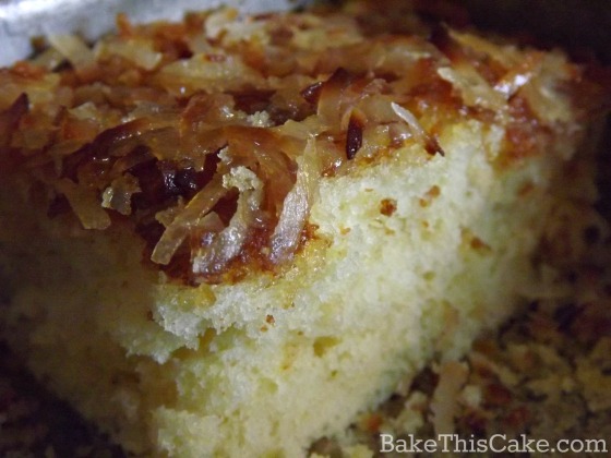Close up look at a slice of vintage Lazy Daisy Cake in the pan by bake this cake